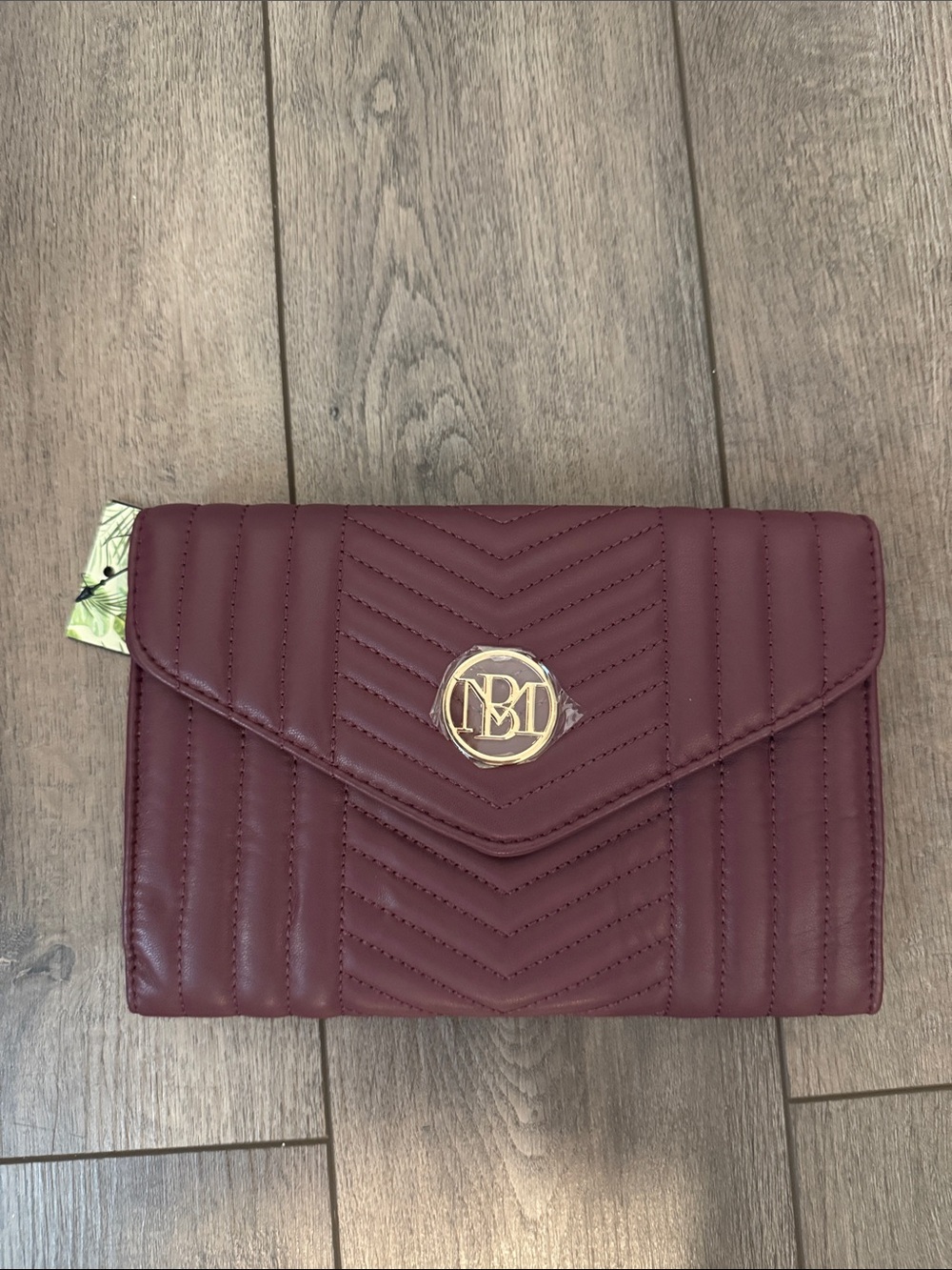 Quilted Burgundy Envelope Clutch with Gold Logo Accent Studio Badgley Mischka